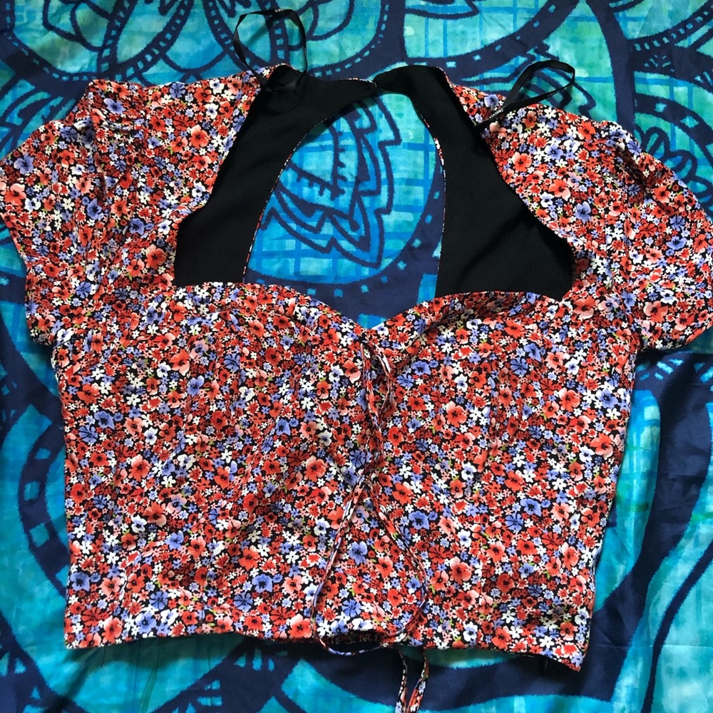 A red floral crop top
